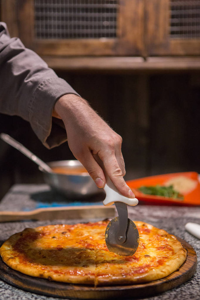 Chef using pizza wheele - Photo, Image