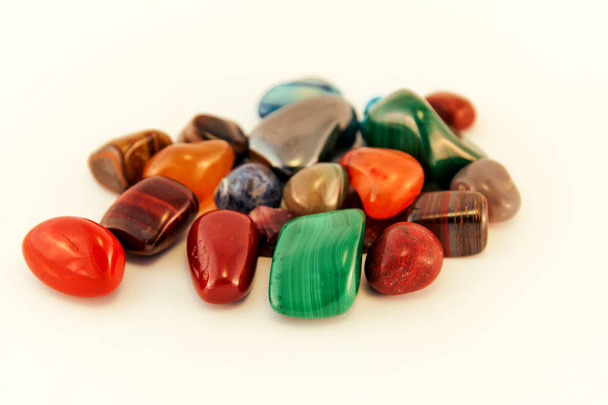 Semi precious stones / Crystal Stone Types / healing stones, worry stones, palm stones, ponder stones / Various stones gemstones background texture / Heap of various colored gems mineral collection. - Photo, Image