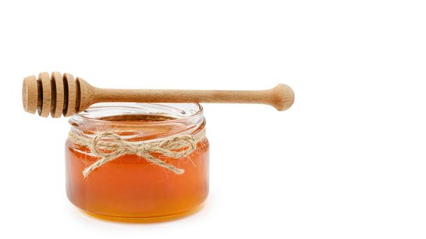 honey pot on isolated white background, rope. copy space, template. - Фото, изображение