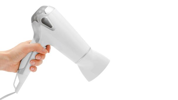 woman hand holding hairdryer. Isolated on white background. copy space, template. - Fotografie, Obrázek