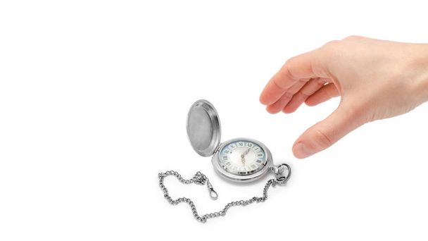 female hand takes or gives pocket watch. Isolated on white background. copy space, template. - Photo, Image