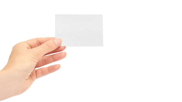 Female hands hold a business card. Isolated on white background. copy space, template - Photo, Image