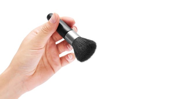make-up brush in hand isolated on white background. copy space, template - 写真・画像