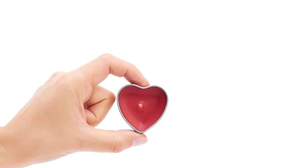 heart shaped candle in hand isolated on white background. copy space, template - Photo, Image