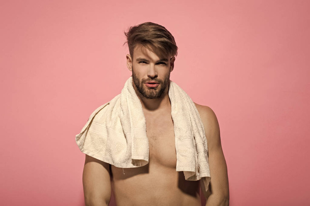 Man with bearded face, stylish hair, towel on muscular torso - Foto, Imagem