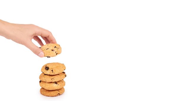 Pile of chocolate chip cookies in hand isolated on white background. copy space, template - Фото, зображення