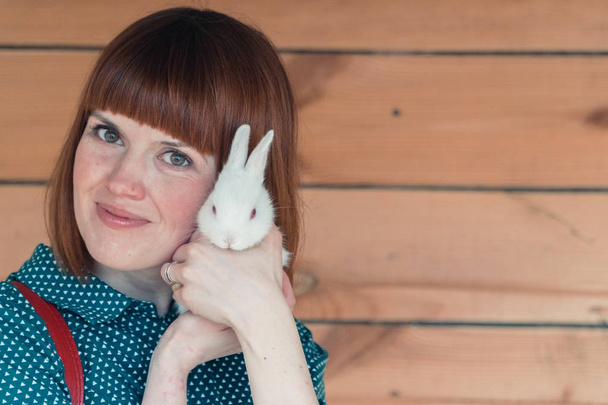 Rabbit, Girl with a white rabbit - Foto, afbeelding