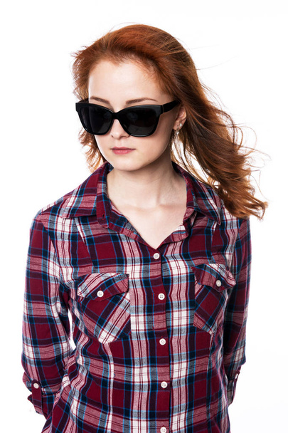 Beautiful woman with sunglasses in plaid shirt - Фото, зображення