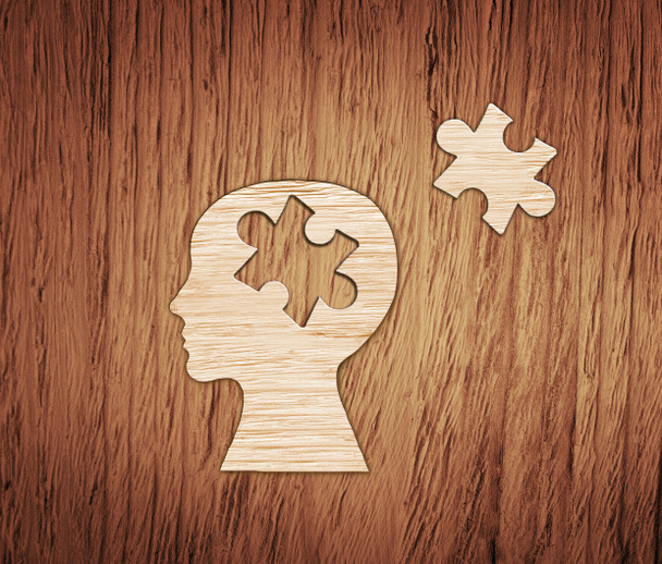 Profil de tête humaine en papier brun avec puzzle
. - Photo, image