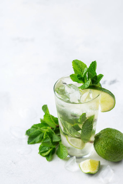 Classic alcohol cocktail mojito with rum, soda, lime and mint - Photo, image