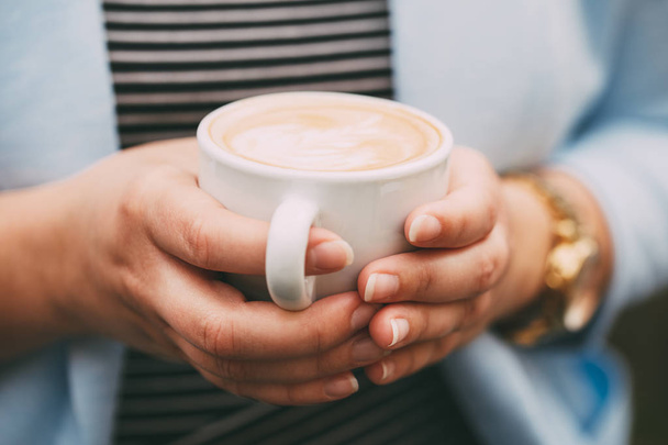 Female hands with a cup of coffee - 写真・画像