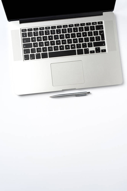 Overhead shot of modern laptop on white background - Photo, Image