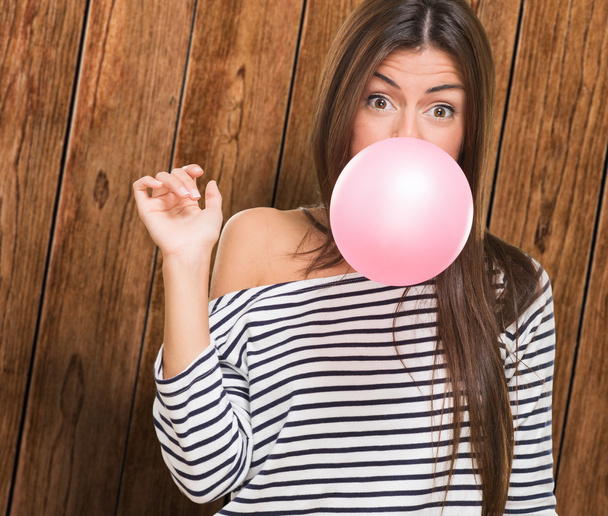 Young Woman Blowing Bubblegum - Photo, Image