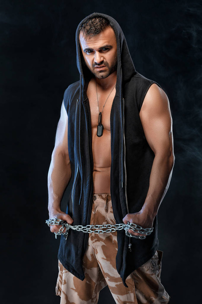 athletic handsome muscular man with chain - Fotoğraf, Görsel