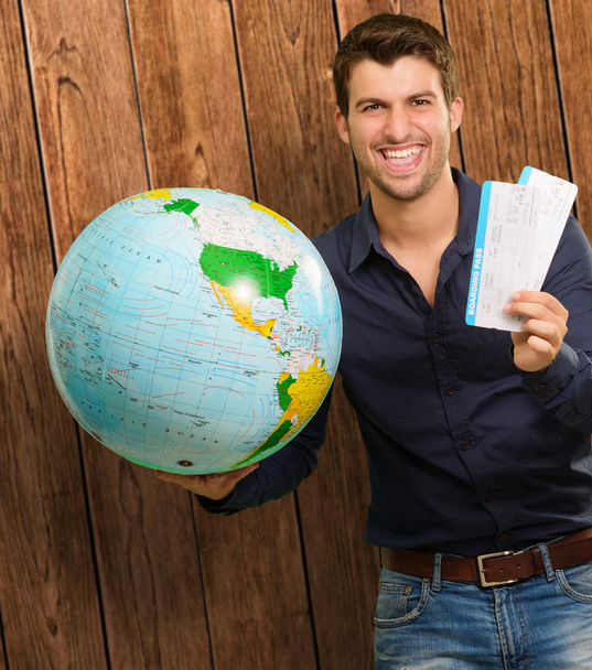Portrait Of A Happy Young Man With Globe And Boarding Pass - Fotoğraf, Görsel