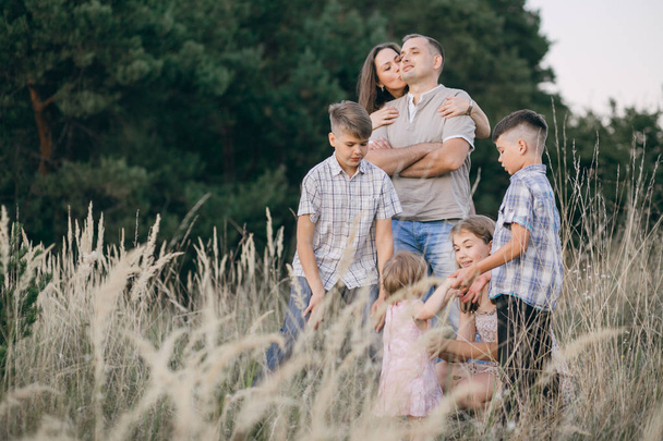family in a field - Фото, зображення