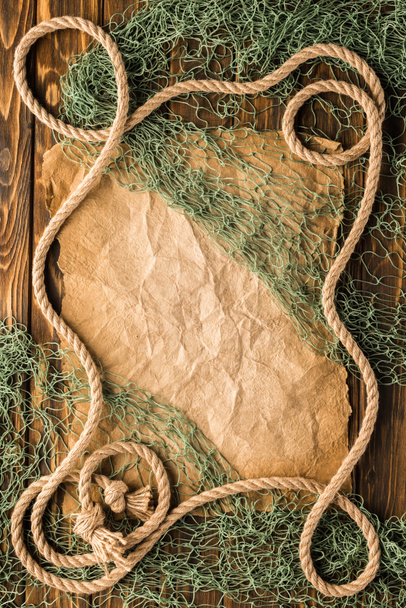 top view of blank crumpled paper with rope and fishing net - Photo, Image