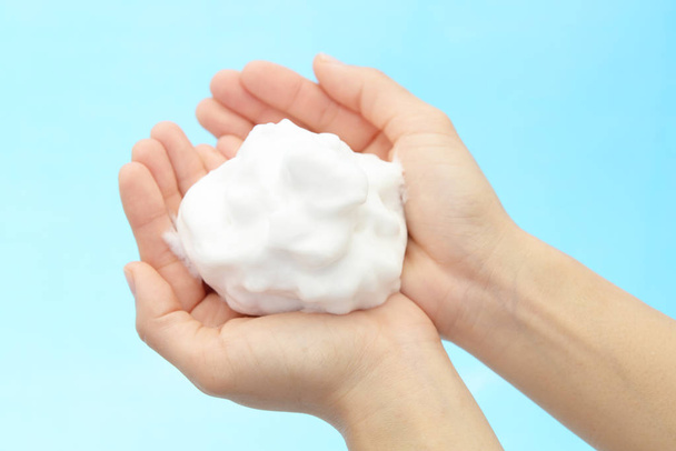 Foam of soap and female hands - Фото, изображение