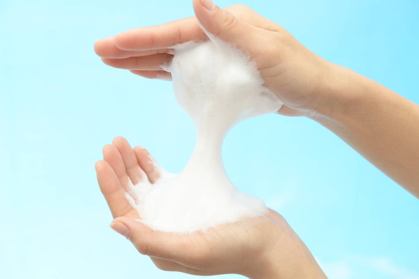 Foam of soap and female hands - 写真・画像