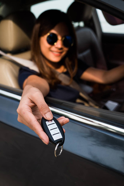 Asian woman holding car key in hand. - Photo, Image
