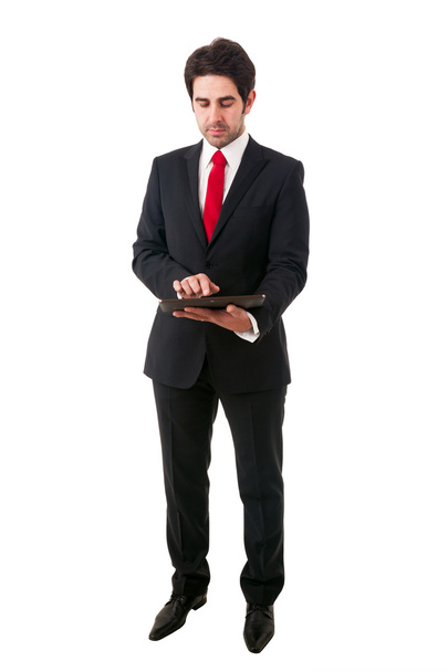 Young business man with tablet computer. Isolated over white bac - Photo, image