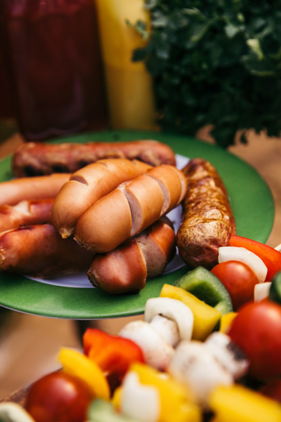 Close-up view of meat sausages grilled for outdoors barbecue - Photo, Image