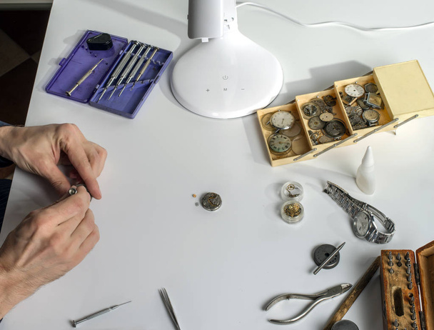 Workplace of the clockmaker for the repair of mechanical watches. - Photo, Image