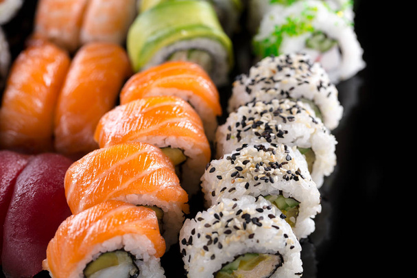sushi on the black background - Φωτογραφία, εικόνα