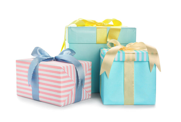 Different gift boxes with bows on white background - Fotó, kép