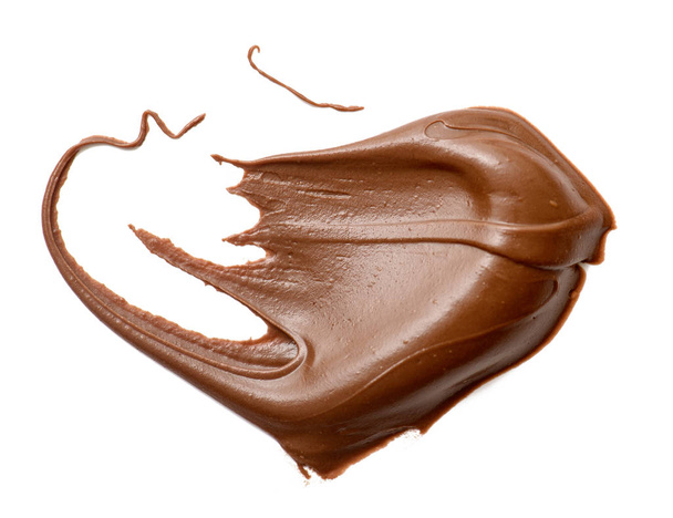 Крем-шоколад розповсюджується ізольовано на білому фоні. харчування ба
 - Фото, зображення