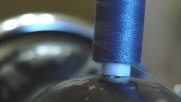 old woman sews jeans on old style seving machine - Footage, Video