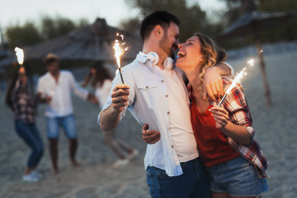 Truly happy playful couple in love having fun at beach - Foto, Imagen