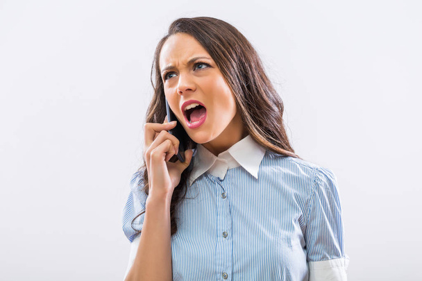 Image of angry businesswoman on the phone shouting. - Foto, Bild