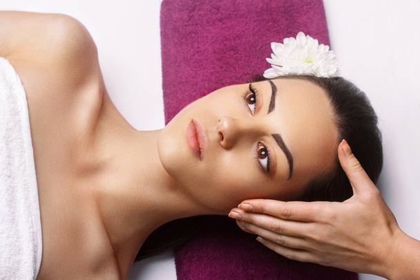 Masseur Doing Massage The Head Of  Woman In The Spa Salon.Facial - Fotografie, Obrázek