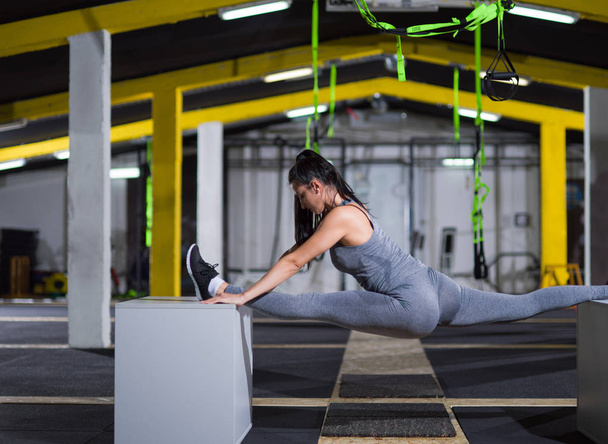 woman working out gymnastic exercise on fit boxes - Fotó, kép