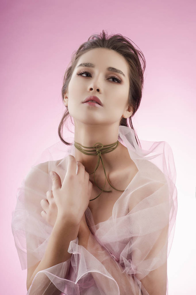 Beautiful charming young big breast asian girl wearing a pink ve - Foto, immagini