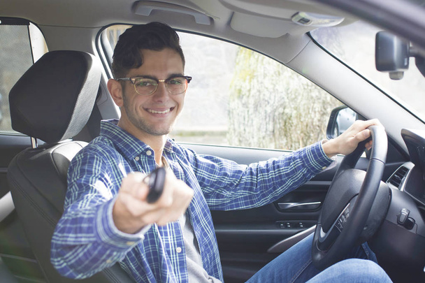 young adult driving the car - Фото, изображение