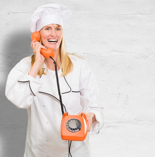 Female Chef Holding Telephone - Photo, Image