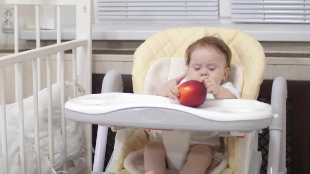 Baby and a beautiful, red apple. - Footage, Video