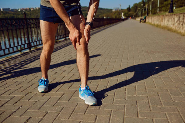 Injury, stretching, bruise on a run in a runner - Fotografie, Obrázek