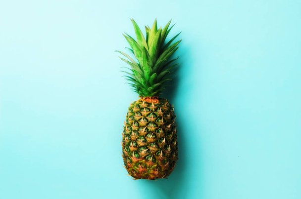 Pineapple on blue background. Top View. Copy Space. Pattern for minimal style. Pop art design, creative concept - Fotó, kép