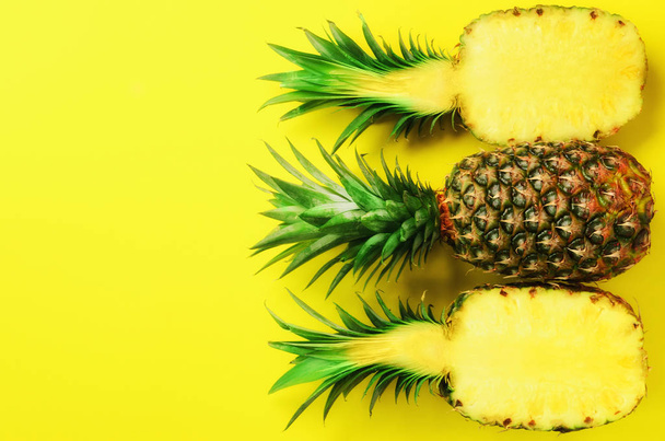 Pattern with bright pineapples on yellow background. Top View. Copy Space. Minimal style. Pop art design, creative summer concept. - Valokuva, kuva