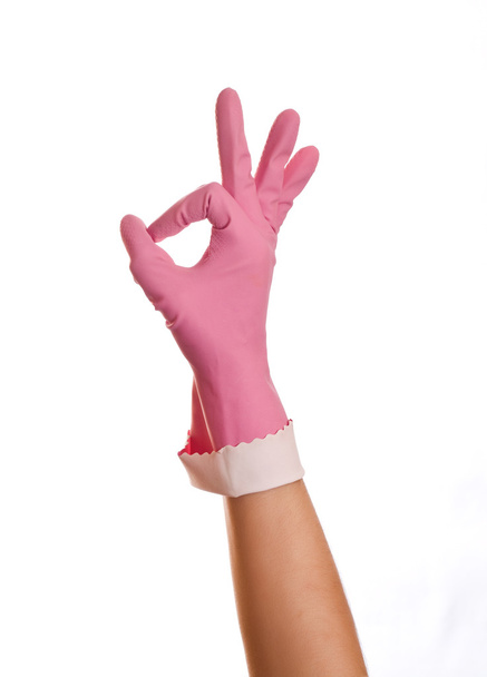ręki sobie różowe gumowe rękawice pokazuje znak ok, na białym tle nad odrobina - Zdjęcie, obraz