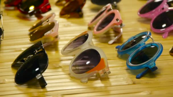 Collection of sunglasses on the counter, Large selection of sunglasses - Footage, Video