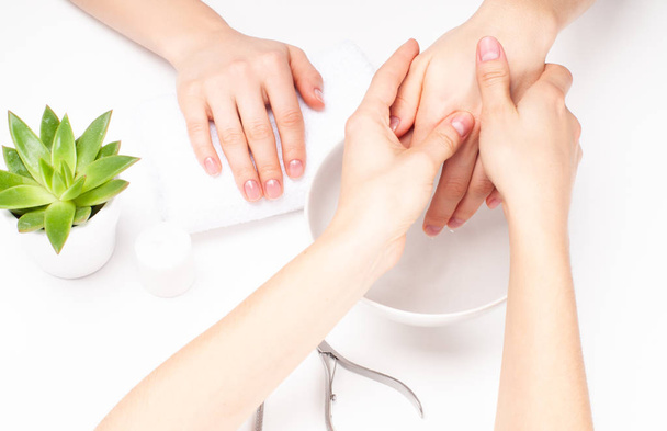 Hands care in the spa. Beautiful woman's hands with perfect manicure - Fotoğraf, Görsel