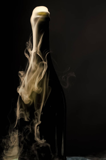 Champagne bottle with smoke - Photo, image