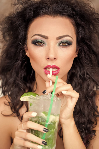 Sexy woman drinking mojito - Фото, изображение