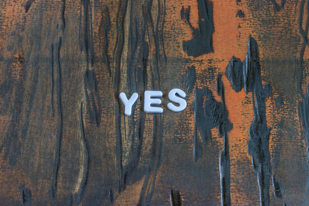 the word yes written in white block letters - Photo, Image