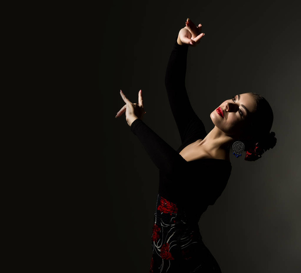 flamenco dancer on a dark background. free space for your text - Фото, зображення