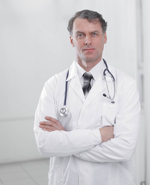 confident adult doctor looking at the camera. - Фото, зображення